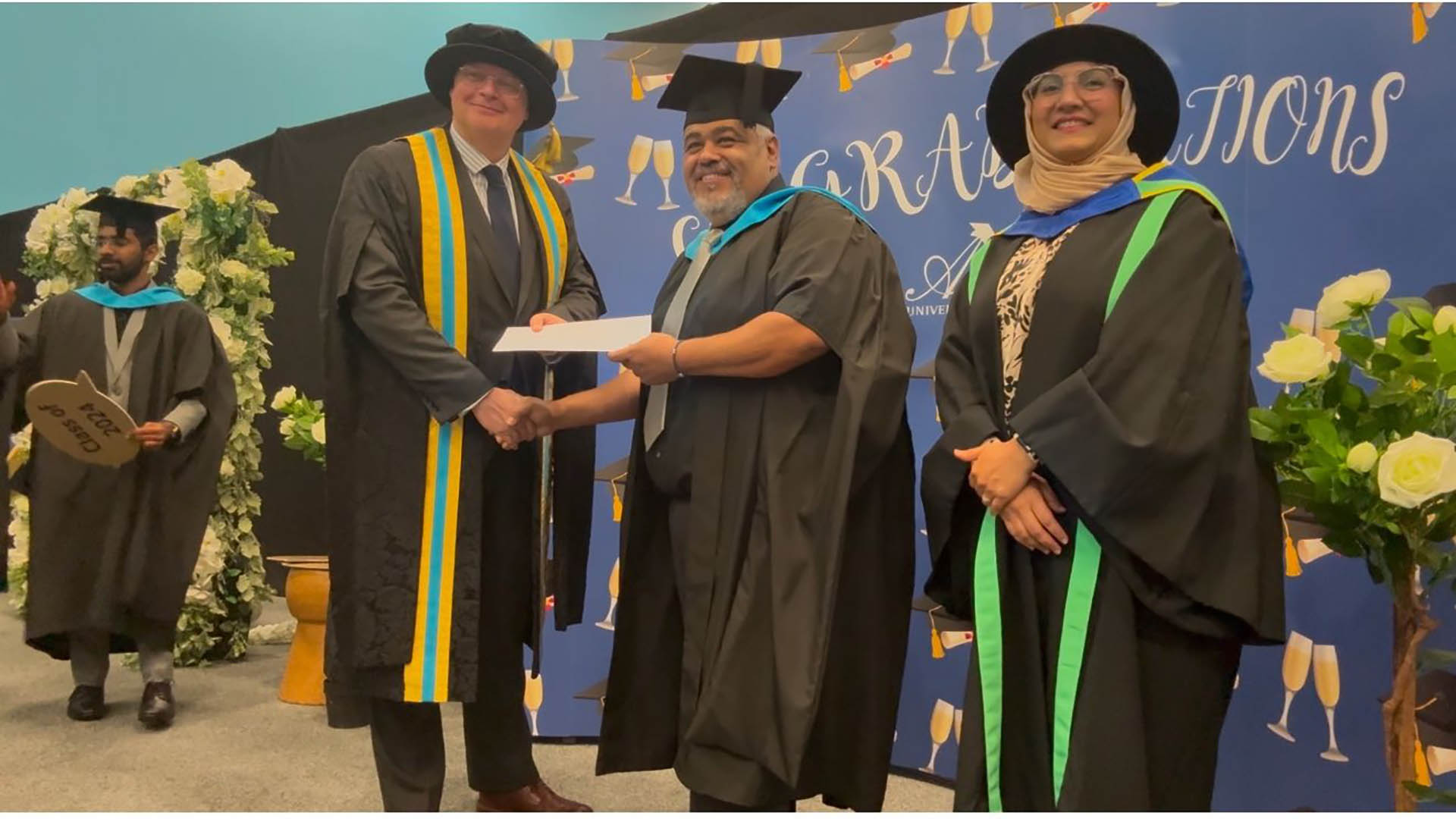 Amro Elrouby with Richard Hill and Shamaila Iram at prize giving