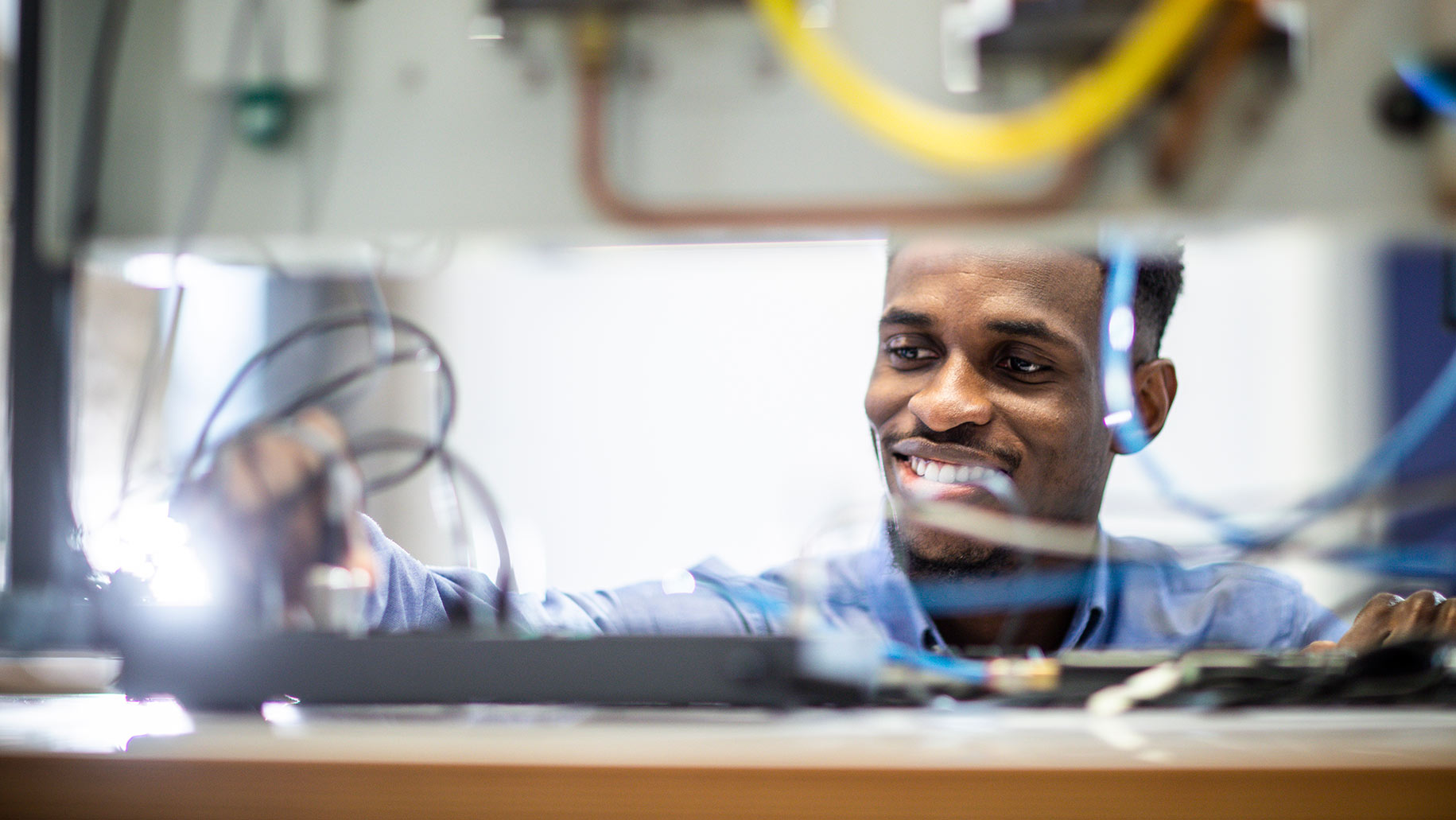 A student looking at engineering equipment 