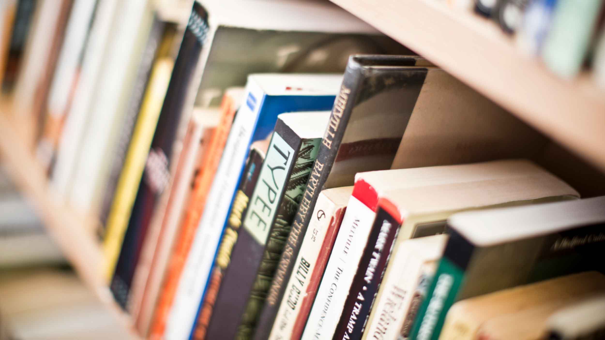 Books on a shelf in Library