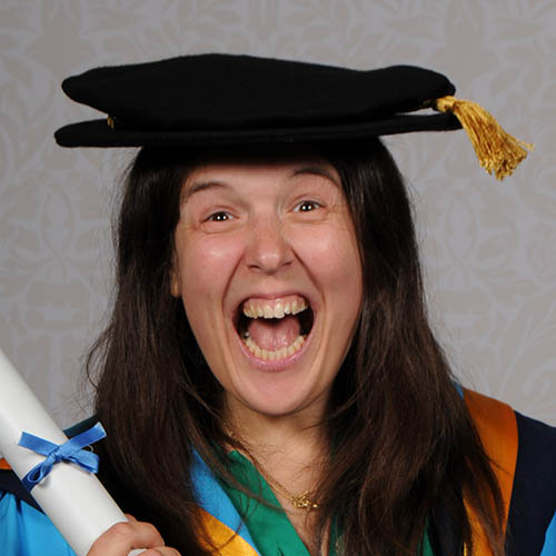 Rosie Jones smiling in graduation garb