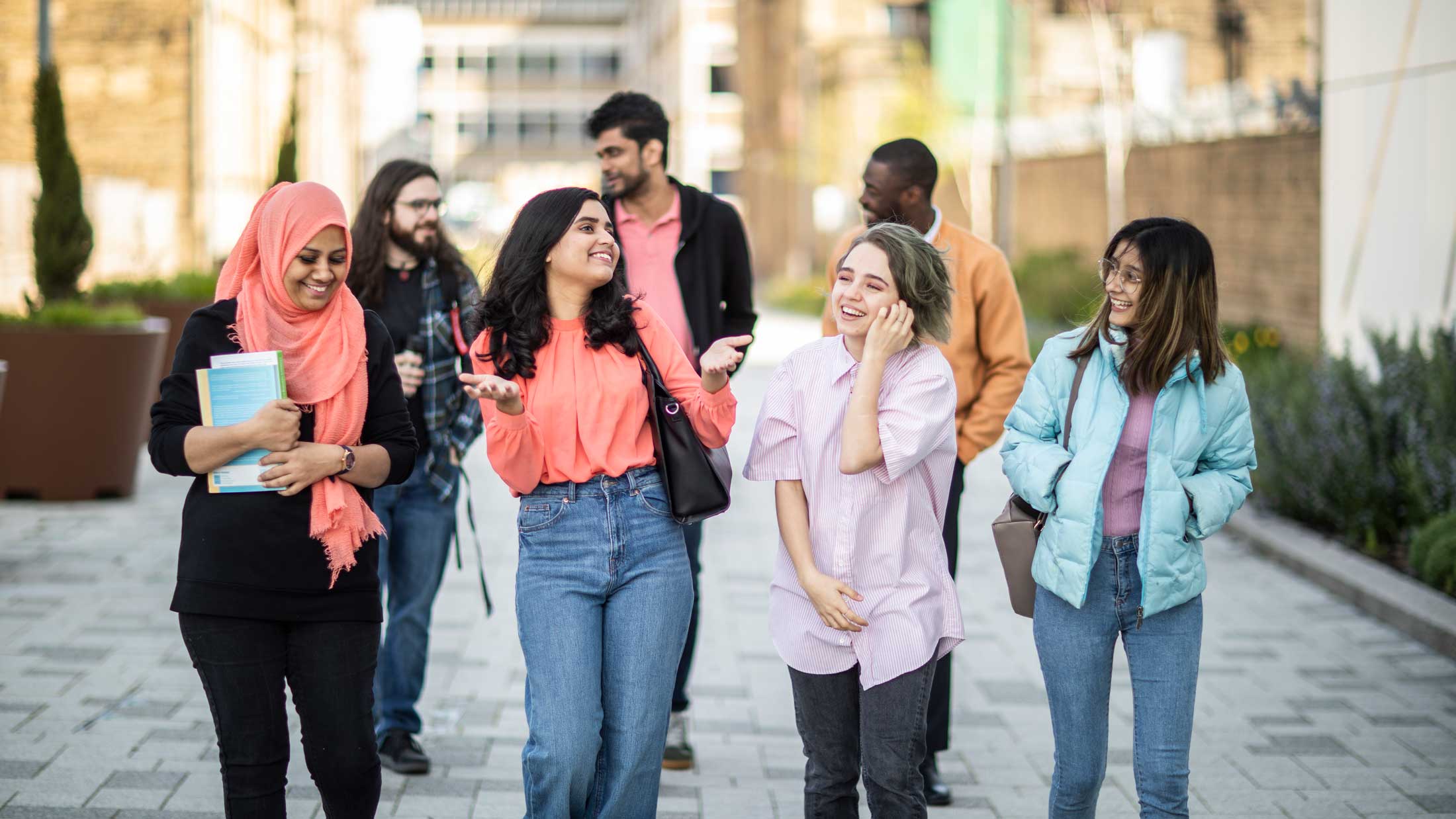 students laughing and walking