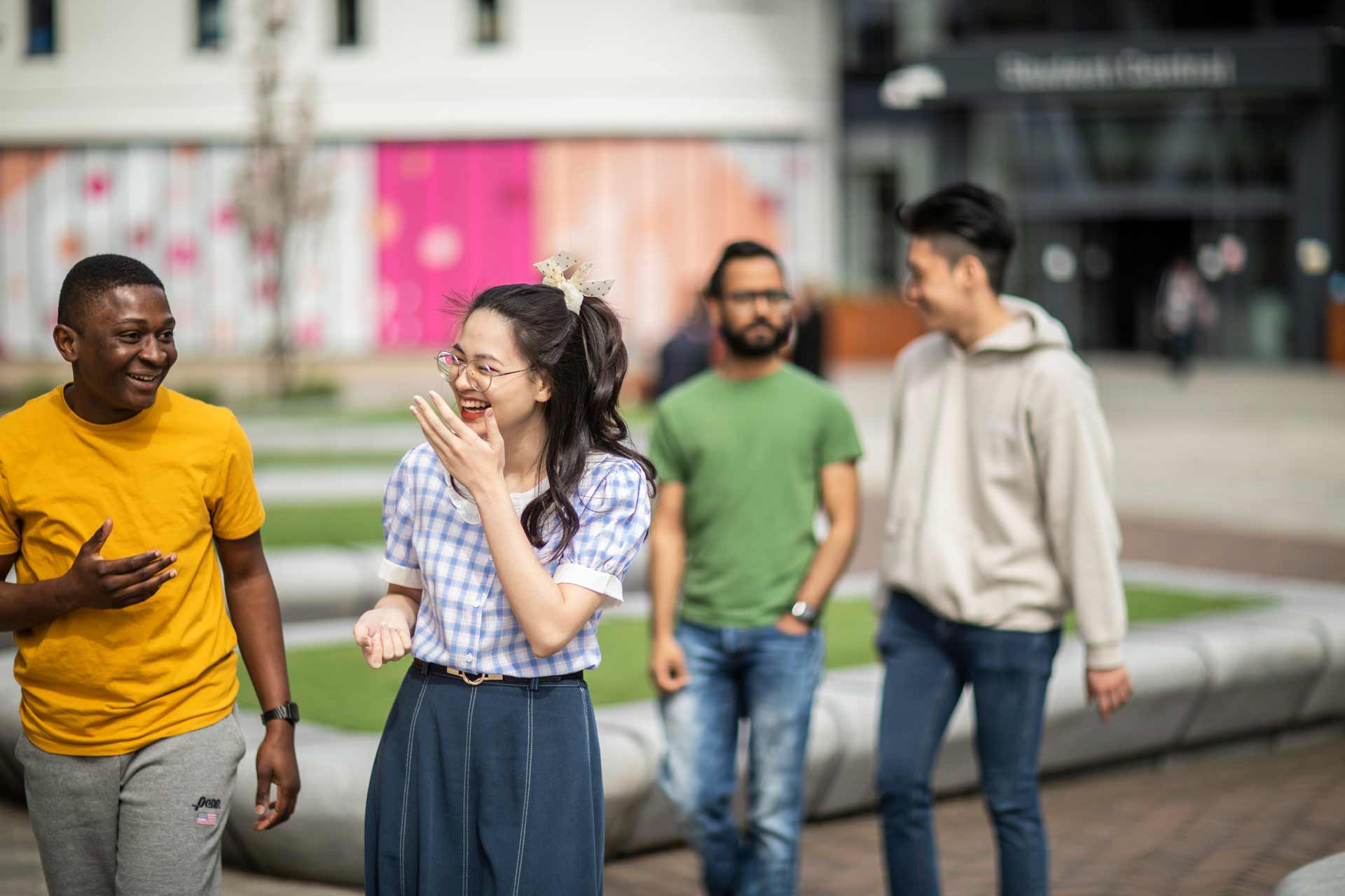 students laughing on campus