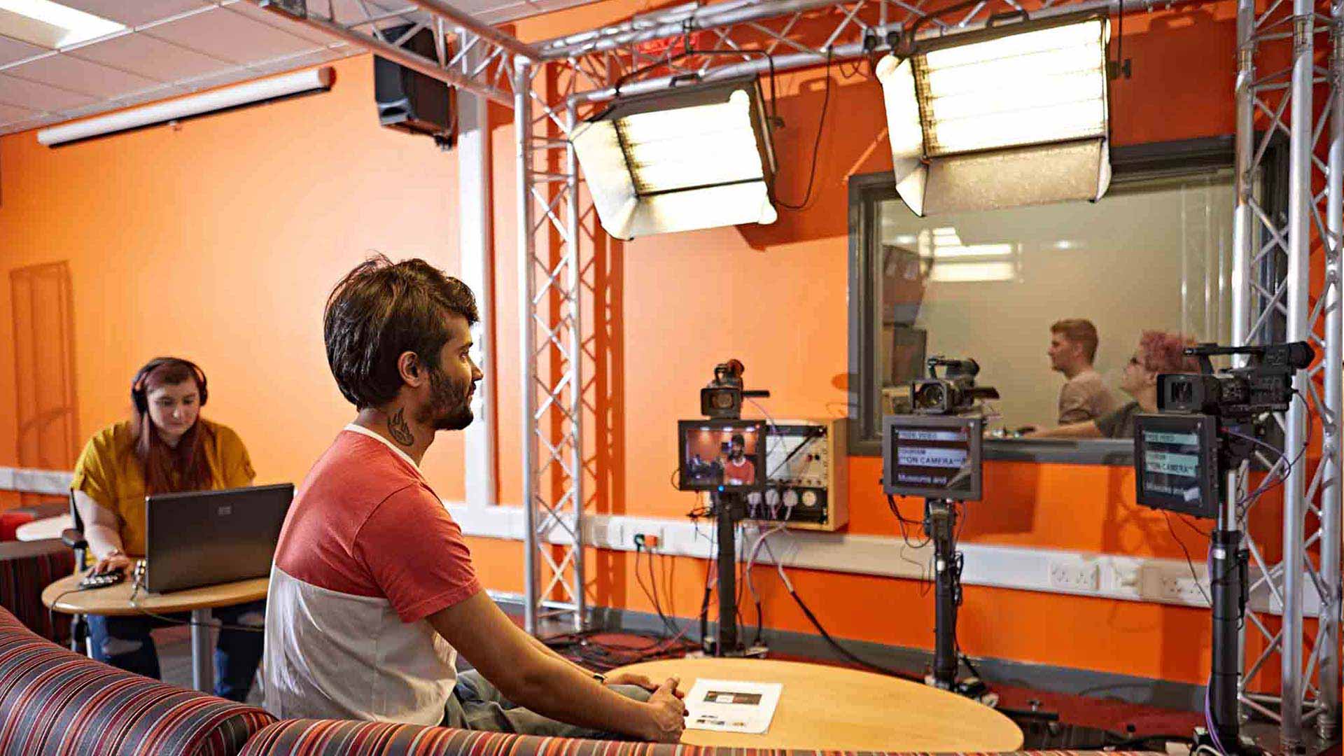 A photo of students using a new stage and productioni control room