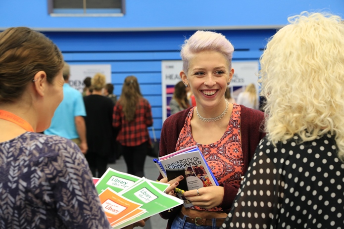 Students interacting with people outside on campus as part of an open day